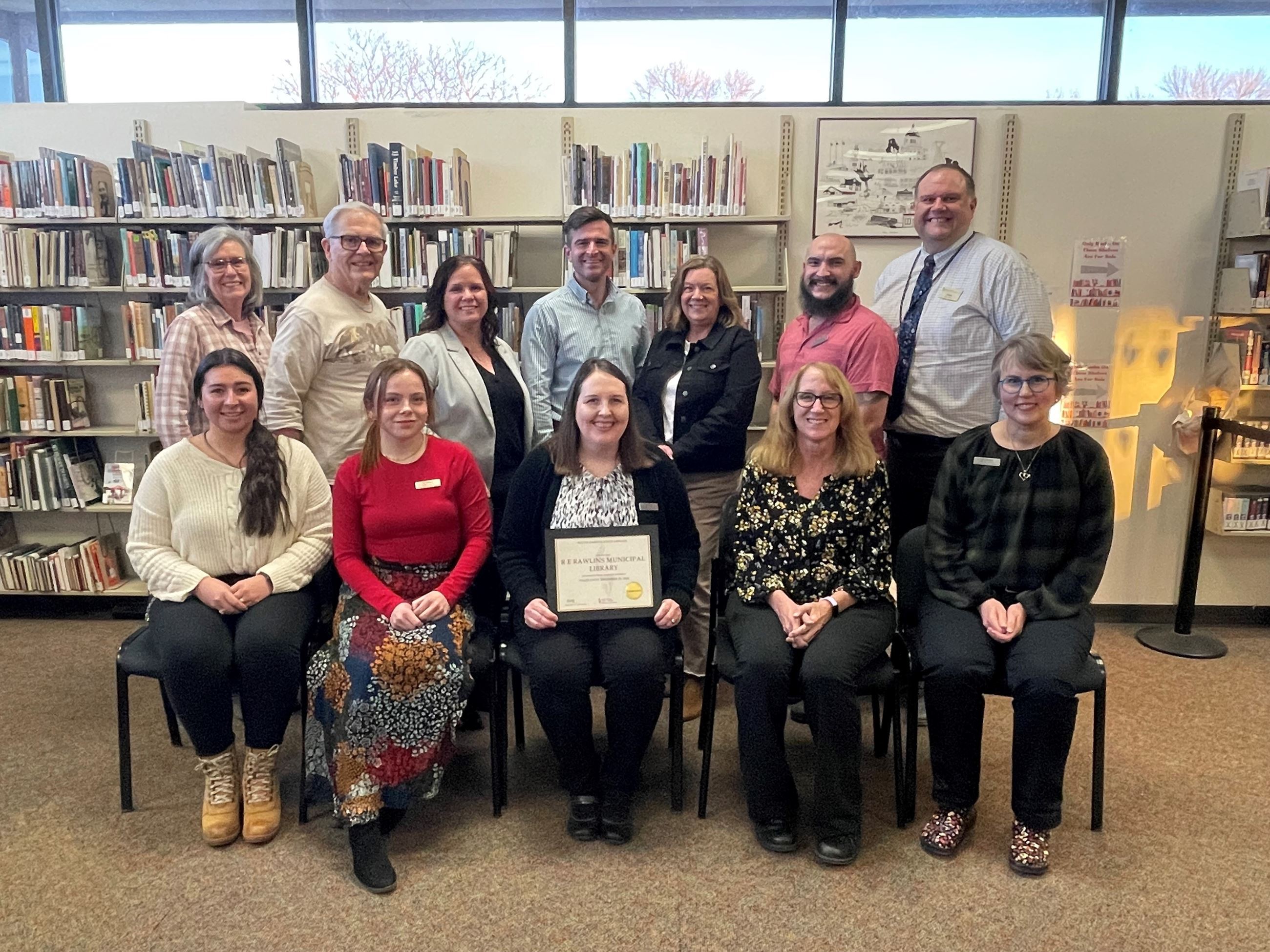 LIBRARY ACCREDITATION AWARD_image of staff and board members with certificate